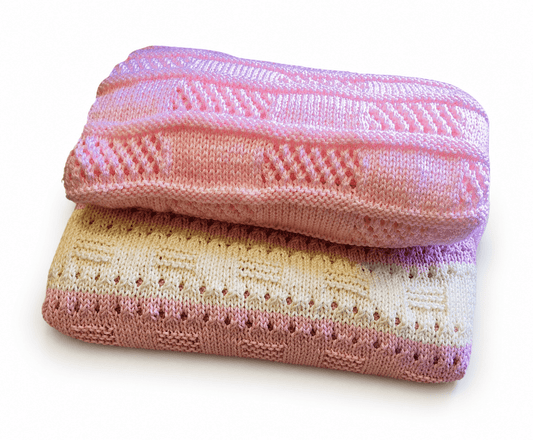 Two folded knitted blankets with a Beautiful Lace pattern on a white background