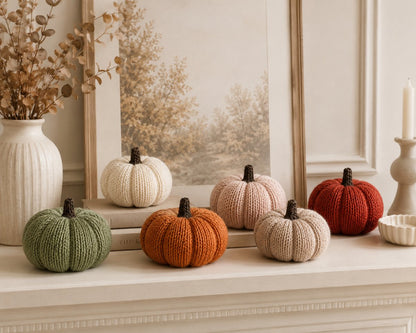 Knitted pumpkin home decor display on a neutral autumn mantel shelf in cream, sage, blush, oatmeal, rust and burnt orange shades from a pumpkin knitting pattern worked flat by Peach Unicorn Designs