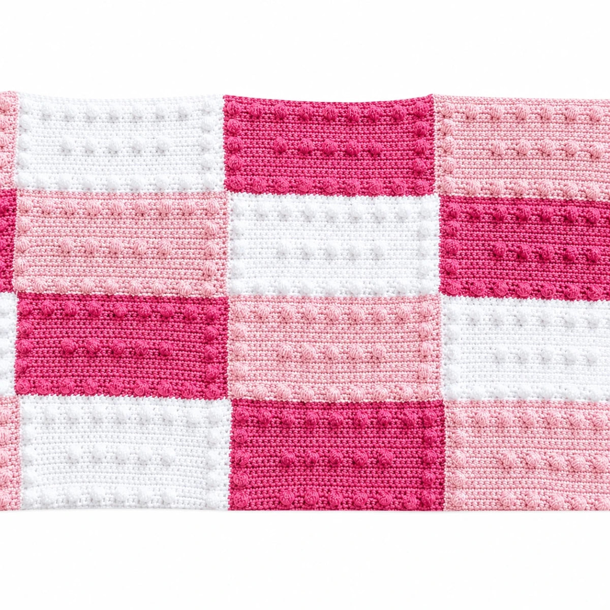 Crochet blanket made from pink and white puff stitch practice blocks