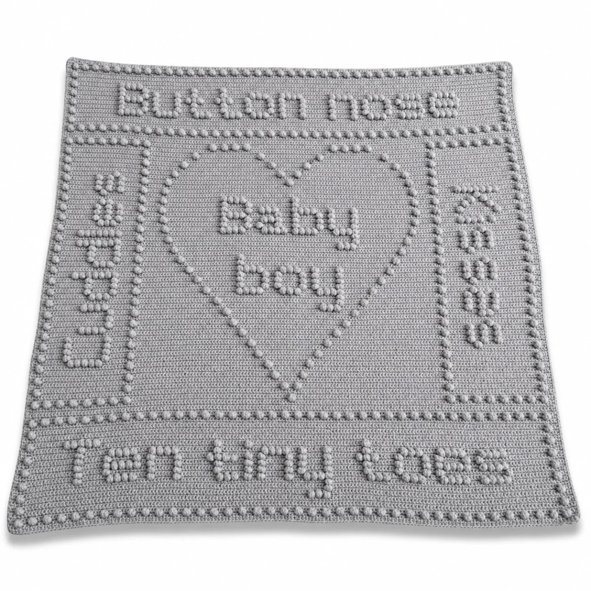 Button Nose baby blanket crochet pattern with heart motif, baby-themed wording and textured crochet design.