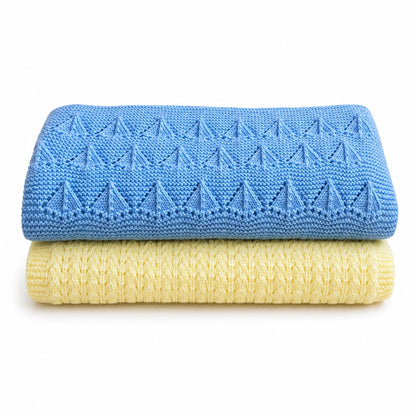 Folded blue and pastel yellow baby blanket knitting pattern bundle with textured Little Boats and Corn Rows stitch patterns on a white background with soft shadow