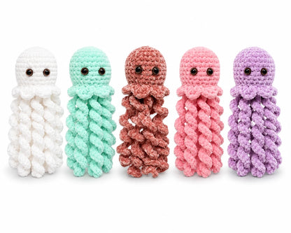 Crochet jellyfish plush toy colour options in white, mint, dusty rose, pink and lilac on a white background