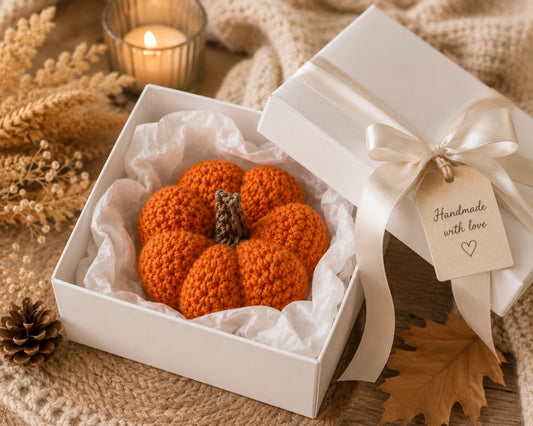 Handmade crochet pumpkin presented in a luxury white gift box with satin ribbon and autumn décor