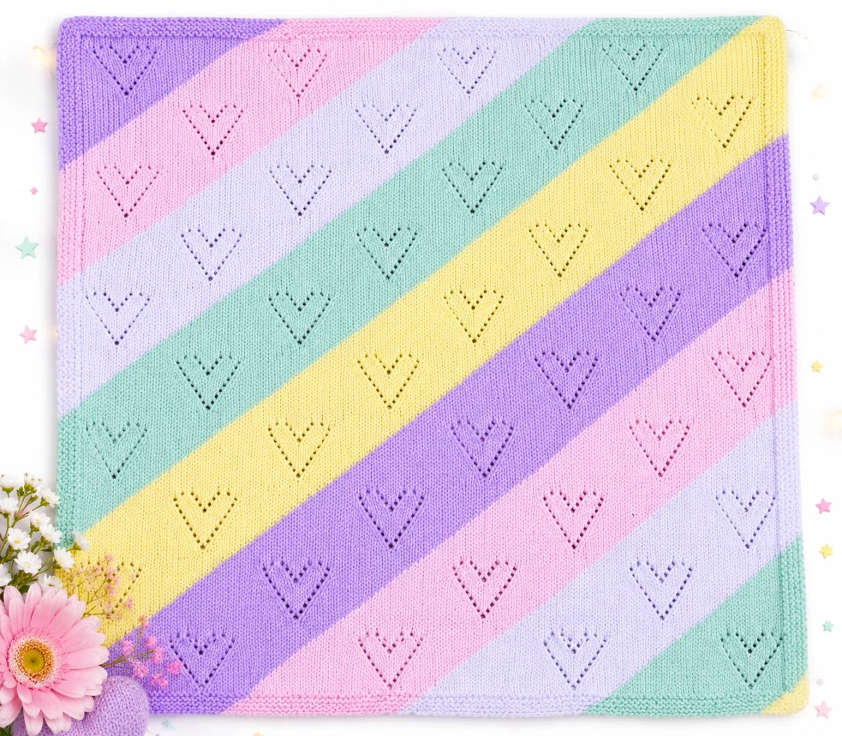 Pastel Diagonal Lace Hearts baby blanket knitting pattern with coloured stripes and lace hearts
