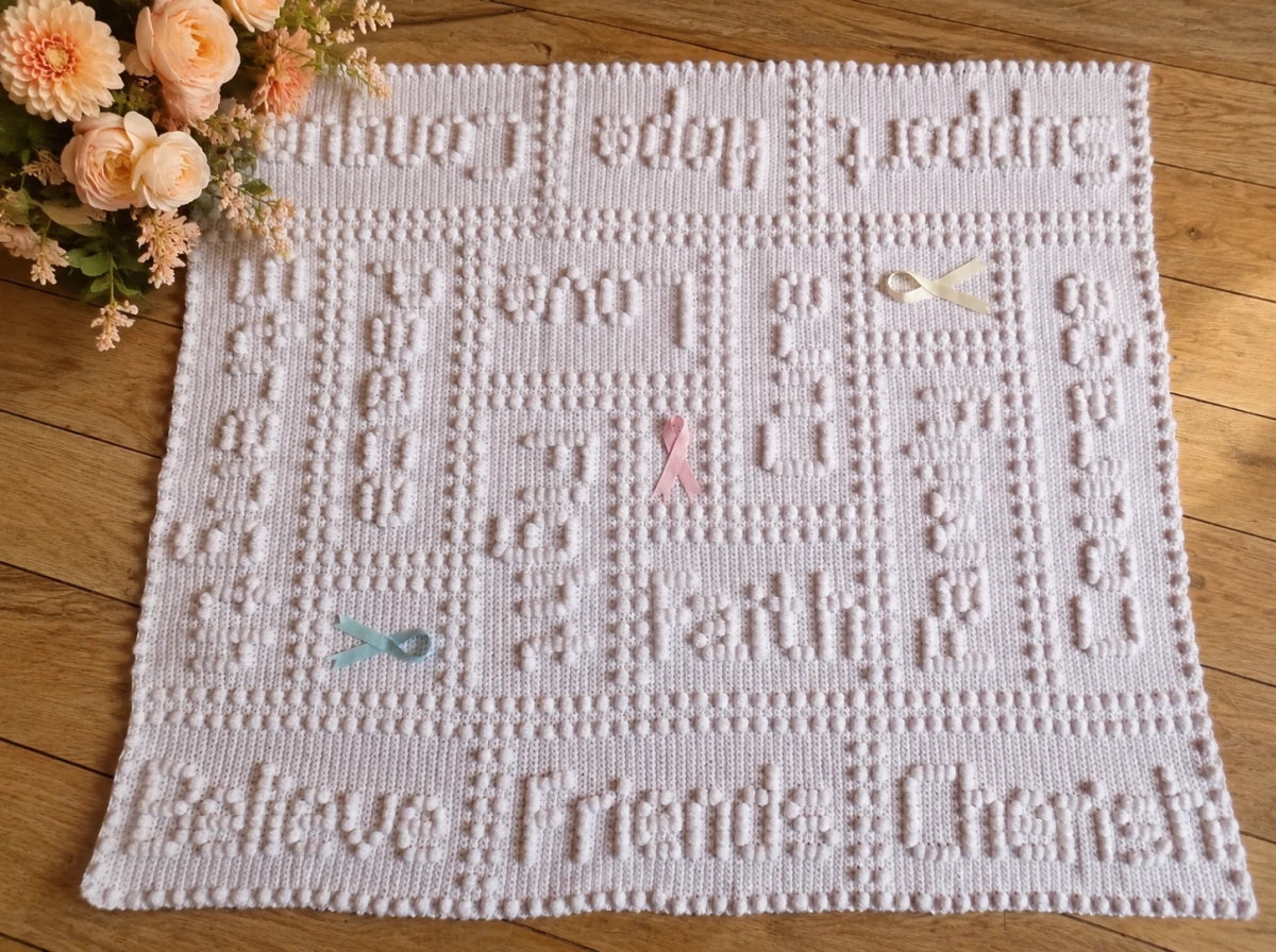 Free Cancer Support One-Piece Crochet Lap Blanket Pattern with Peach Flowers on Wooden Floor