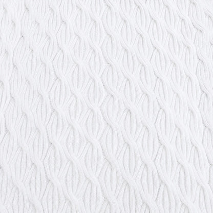Close-up of plain white Rainbow Waves baby blanket featuring repeating cable knitting texture and stitch detail