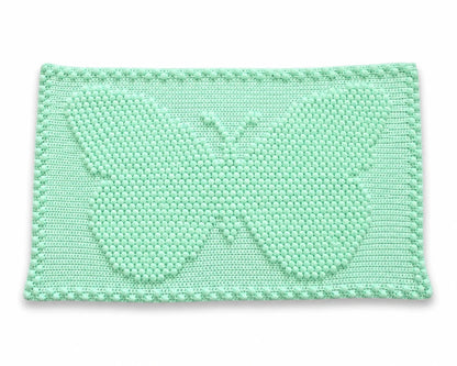 Free small butterfly one-piece crochet blanket pattern on a white background with soft shadow