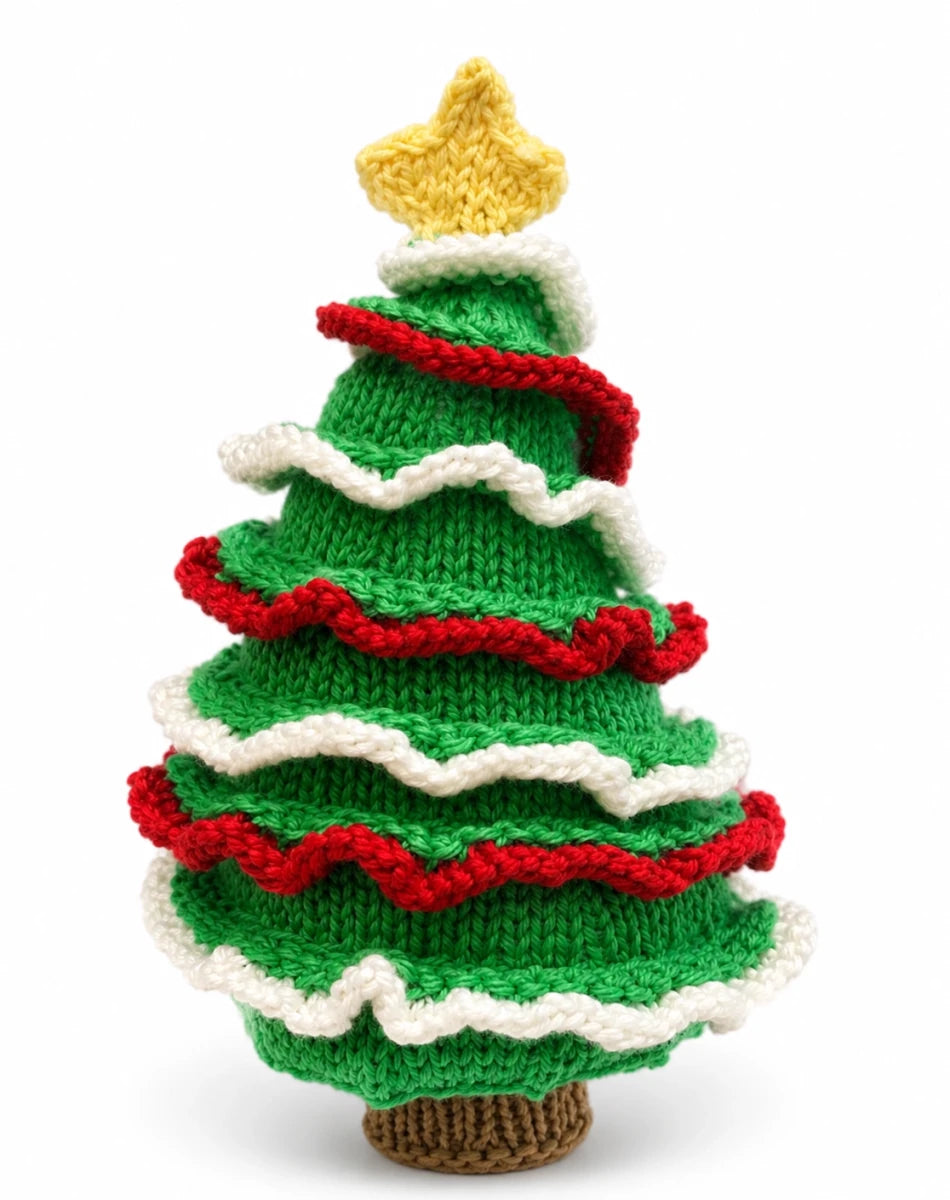 Close-up of a knitted Christmas tree decoration with layered ruffled red and white garlands, yellow star topper and worked flat construction.