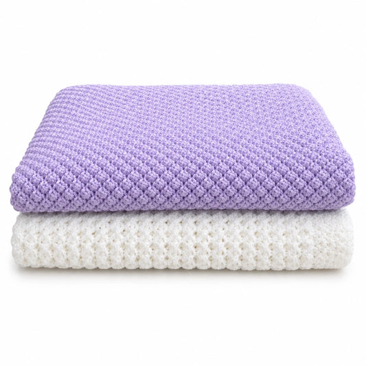 Folded lilac Blackberry baby blanket stacked on white Lattice Love baby blanket knitting pattern bundle on a white background