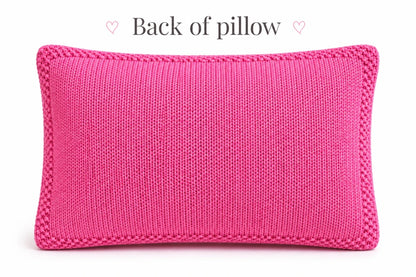 Back of pink LOVE pillow knitting pattern showing smooth stockinette stitch fabric with narrow seed stitch border around the cushion cover