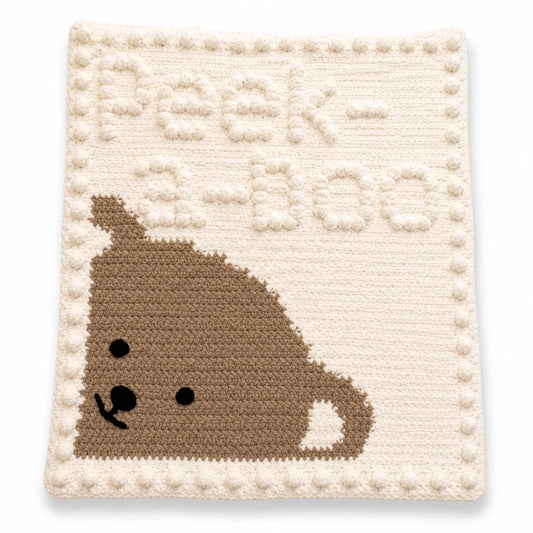 Peekaboo Baby Blanket crochet pattern made with super chunky yarn displayed on a white background with a soft shadow.