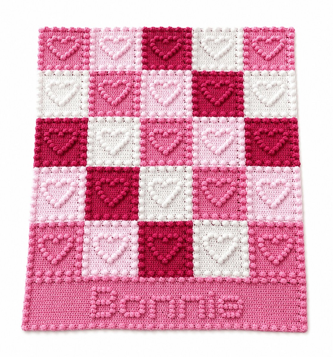 Personalised crochet baby blanket with heart puff stitch squares and the name Bonnie