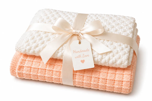 Gift wrapped Pretty Squares and Diagonal Bumps baby blanket knitting pattern bundle tied with a satin ribbon and handmade with love tag