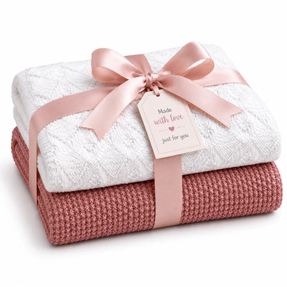 Gift wrapped baby blanket knitting pattern bundle featuring the Rice Stitch and Diamonds Are Forever knitted blankets with soft pink ribbon and handmade gift tag on a white background.