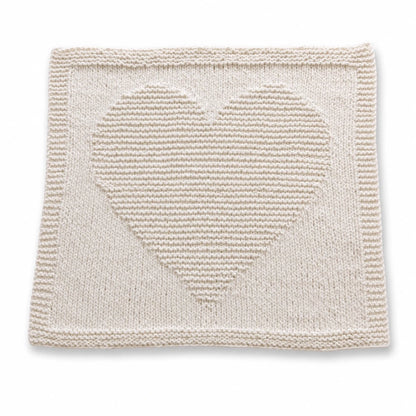 Simple Chunky Heart Baby Blanket knitting pattern in vanilla super chunky yarn with raised heart motif and garter stitch border