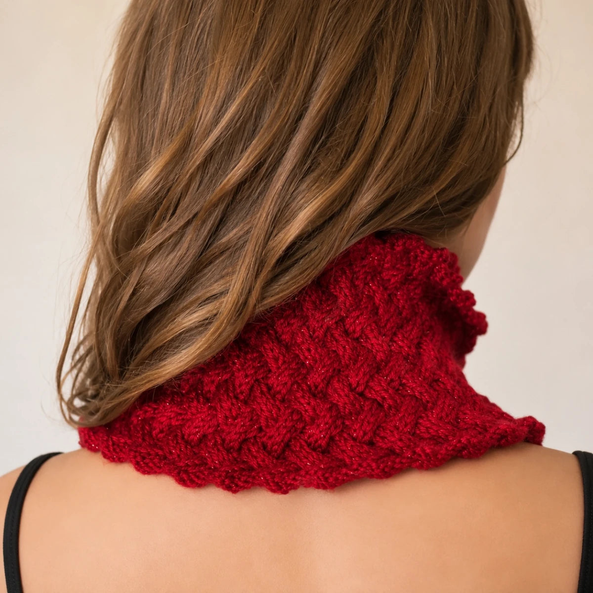 Back view of the Sparkling Basketweave Neckwarmer knitting pattern showing full neck coverage and basketweave stitch texture.