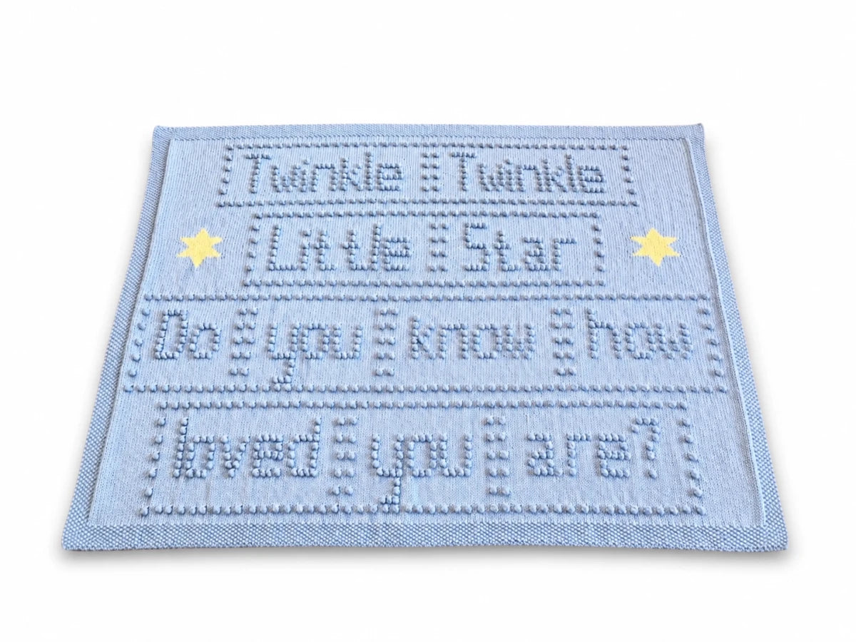 Twinkle Twinkle Little Star baby blanket knitting pattern with bobble-stitch wording and intarsia stars