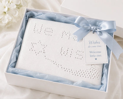 We Made a Wish baby blanket knitting pattern presented in a luxury white gift box with blue ribbon and welcome little one gift tag