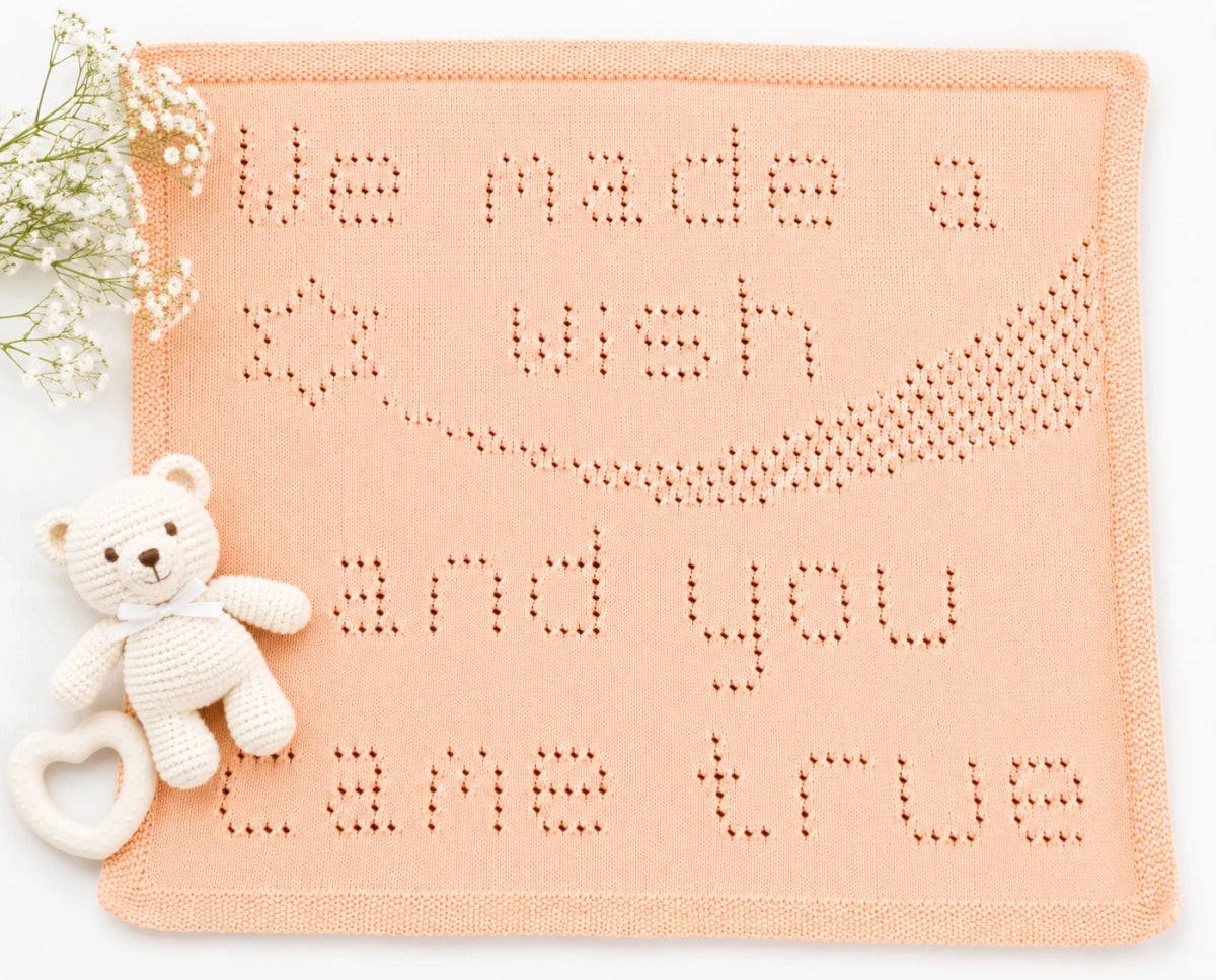 Peach Coloured, We made a Wish blanket with white flowers ann white baby toys.