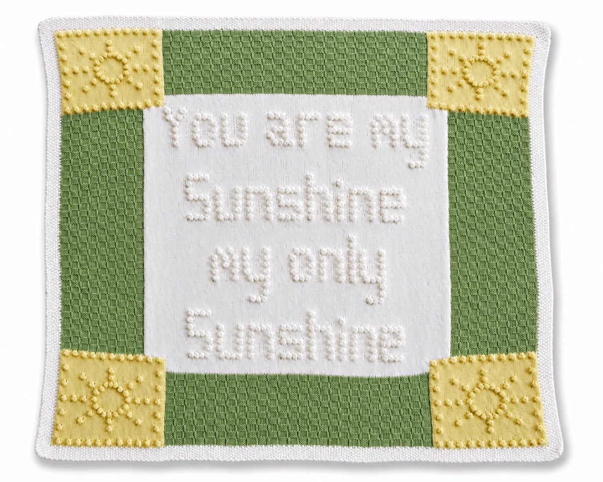 You Are My Sunshine baby blanket knitting pattern with bobble wording and colourful sunshine panels